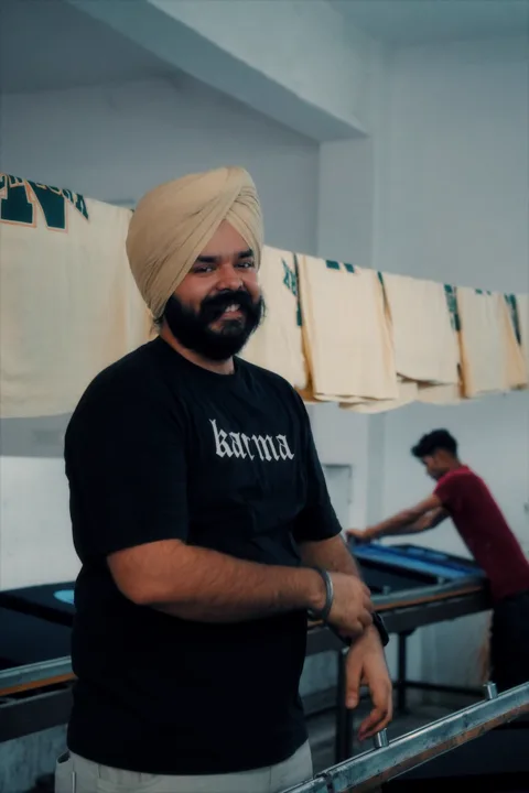 The founder on the print floor, tees drying overhead