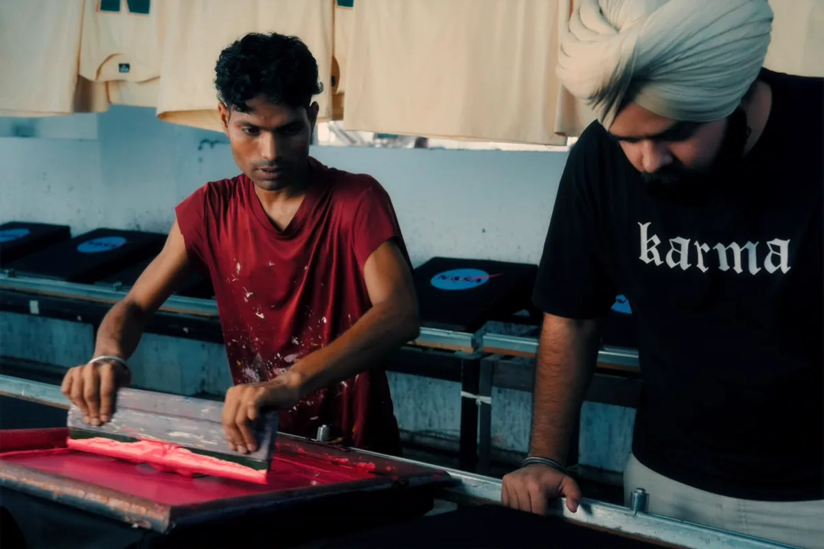 The founder at the screen-printing table with the printer, OFFCULT unit, Ludhiana